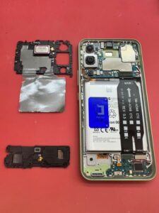 Remove-the-fixing-plate-and-lower-speaker-from-the-motherboard